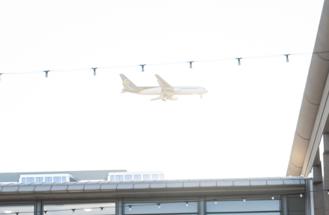 Airplane flying over Spartan Village on the Paseo