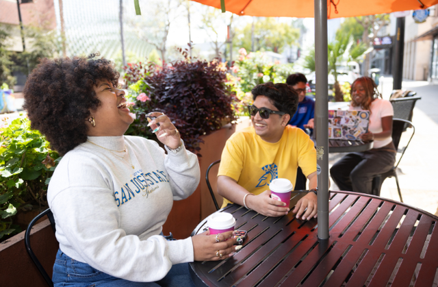 Students outdoor dining at a cafe.